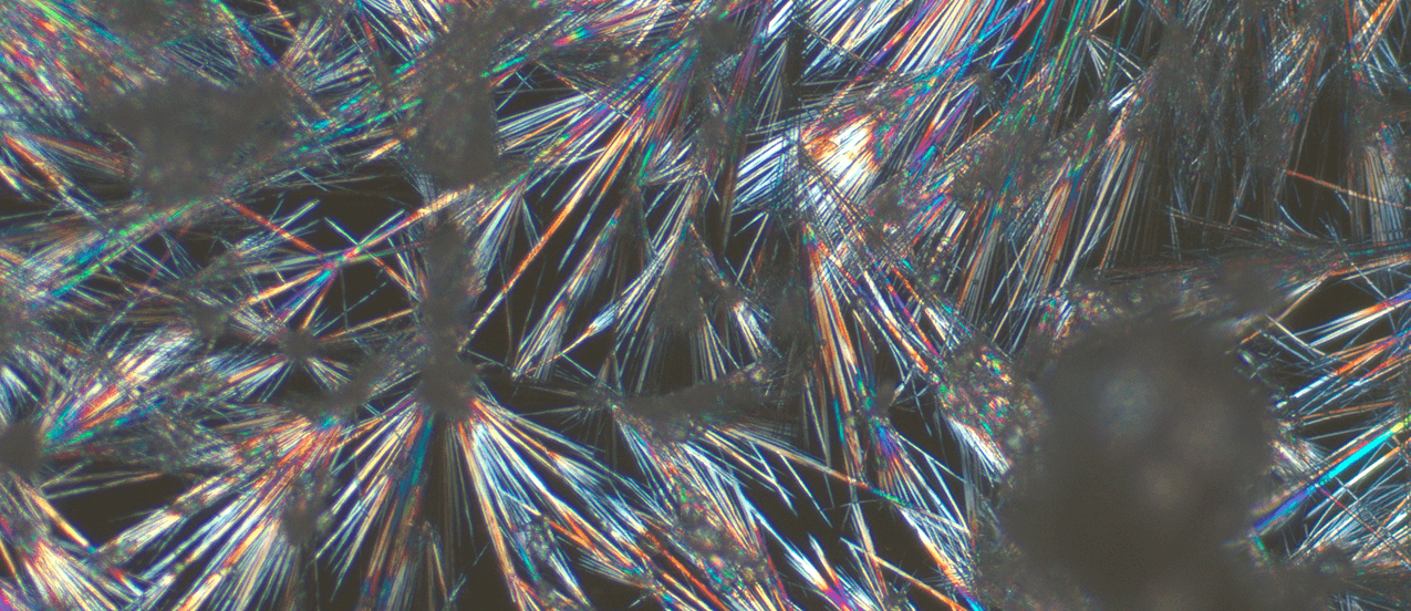 Microscopic crystal structure with colorful light refraction patterns